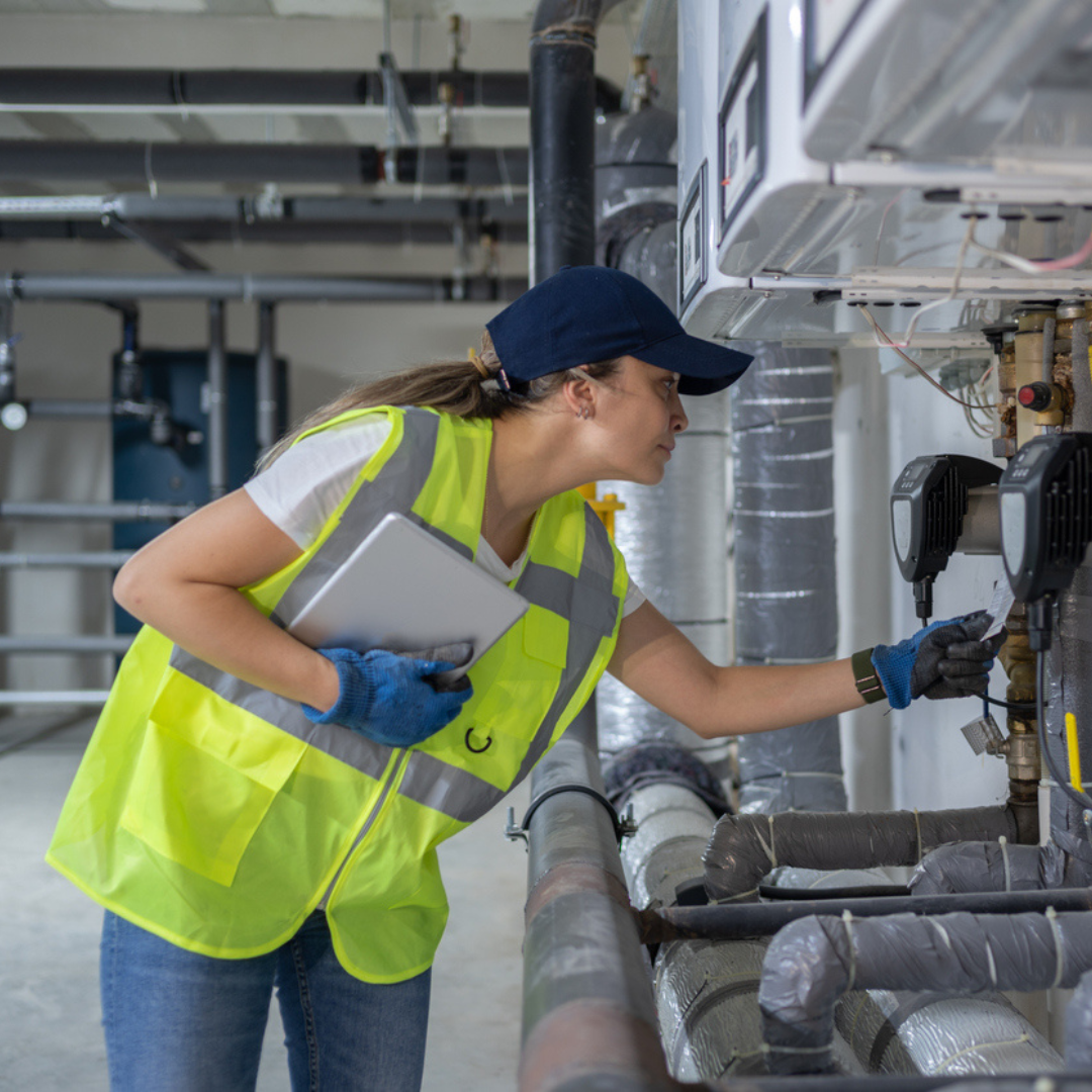 woman checking heat pump