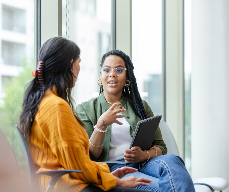 Two women discussing pre-investment support 